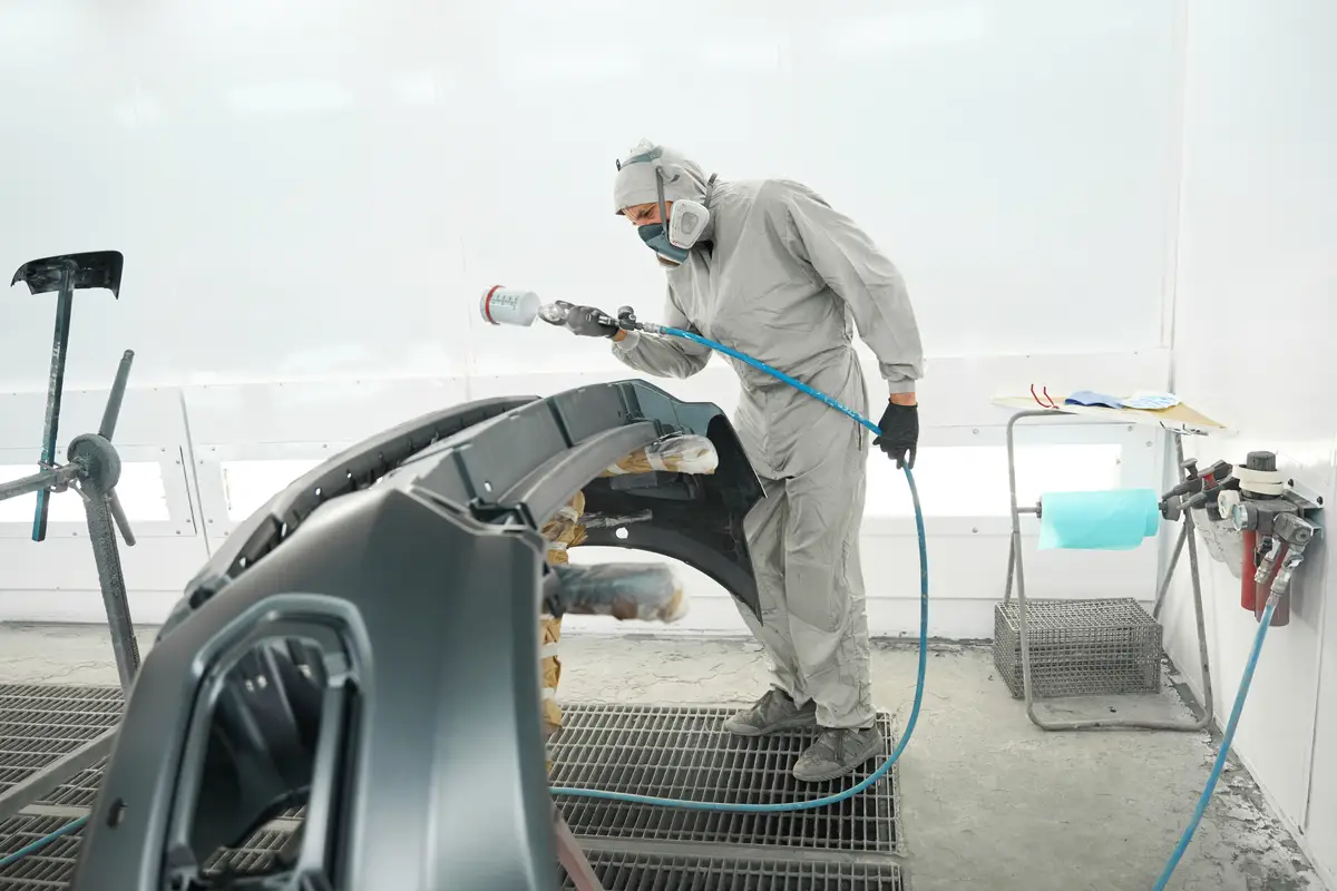 male-doing-color-restoration-for-automobile-parts-